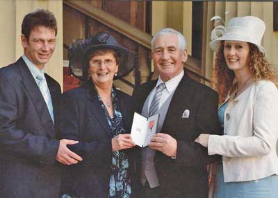 Jim with his family at Buckingham Palace