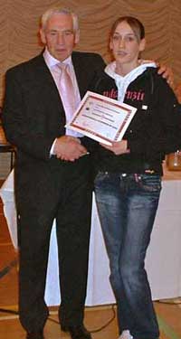 Laura Weightman receives her award from Jim Alder